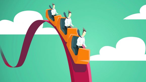 Businessman riding on a roller coaster