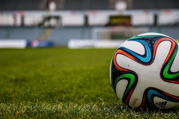 A football on a pitch.