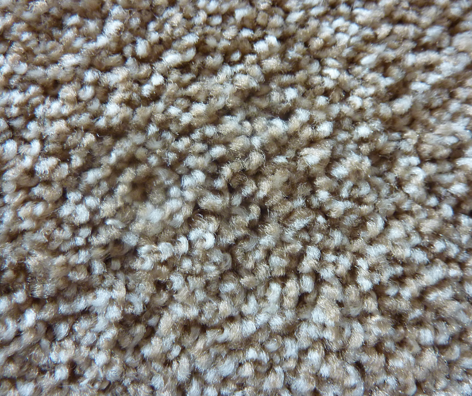 A close-up of a beige carpet.