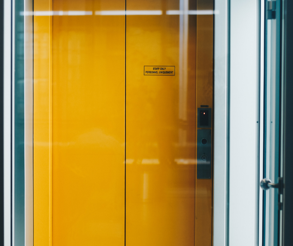 A yellow elevator door.