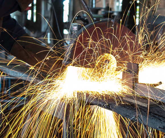 Sparks flying from a saw.