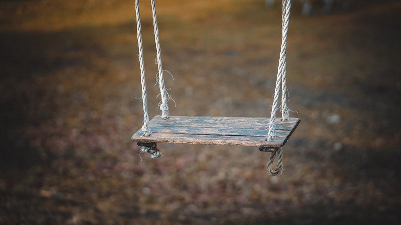 A wooden swing.