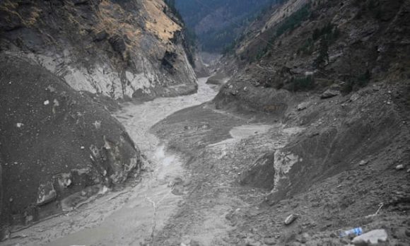 The Rishiganga river in Chamoli district on 9 February, with debris from the hydroelectric plant visible.