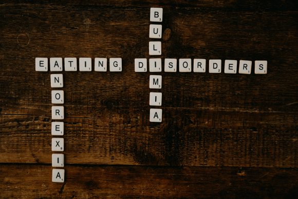 Scrabble tiles spelling out words related to Eating Disorders.