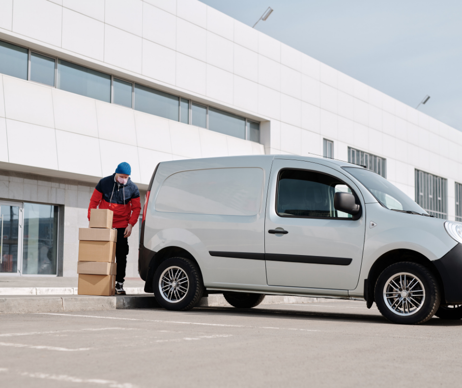 Delivery driver outside white van