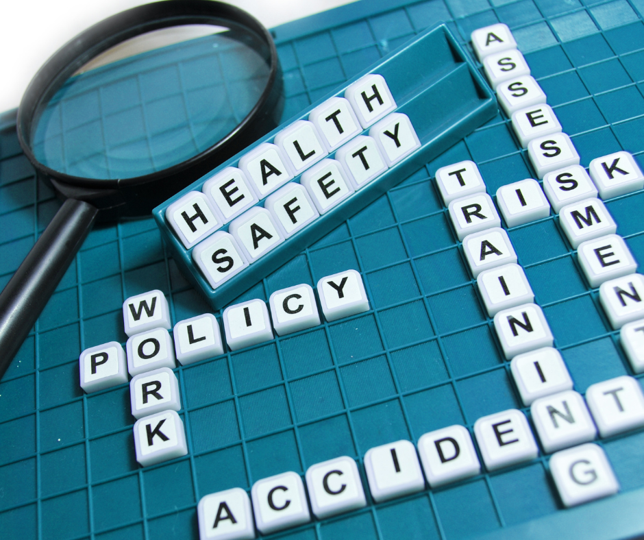 Health and safety words (e.g policy, accident) on a blue scrabble board