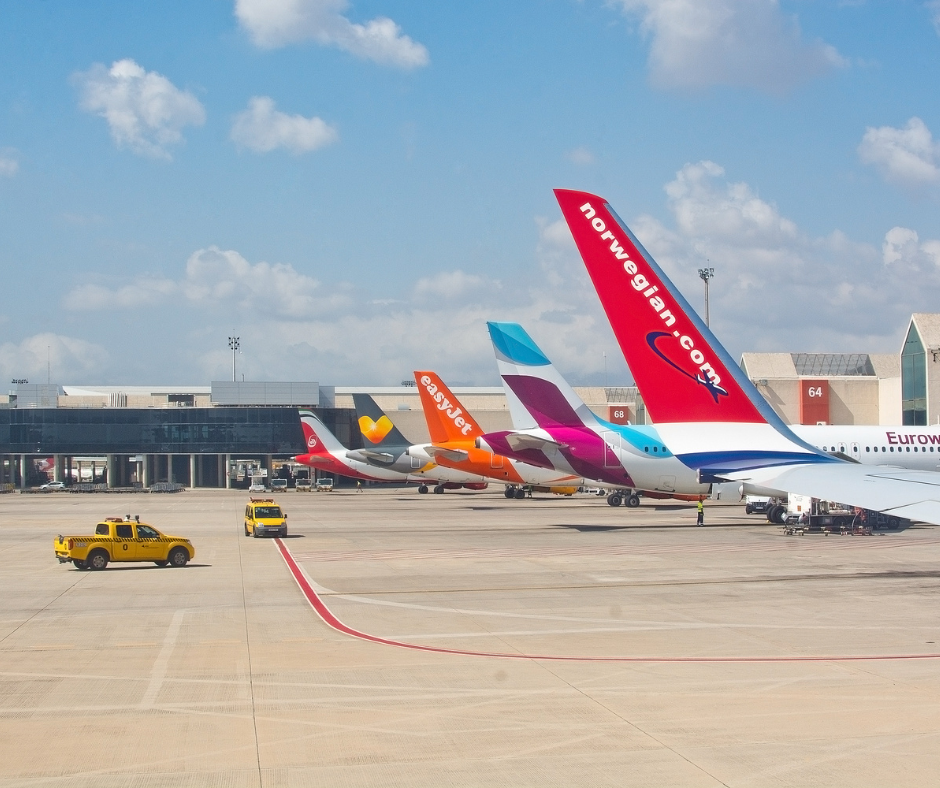 Row of planes at an airport